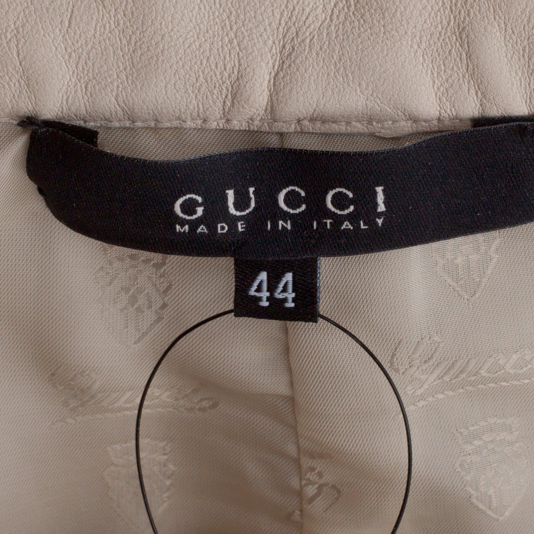 GUCCI, a white leather skirt.