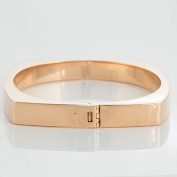 A Gaudy bangle in 18K gold.