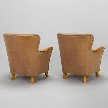 A pair of 1950's armchairs.