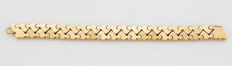 A Cartier 18K gold "Double Hearts" bracelet.