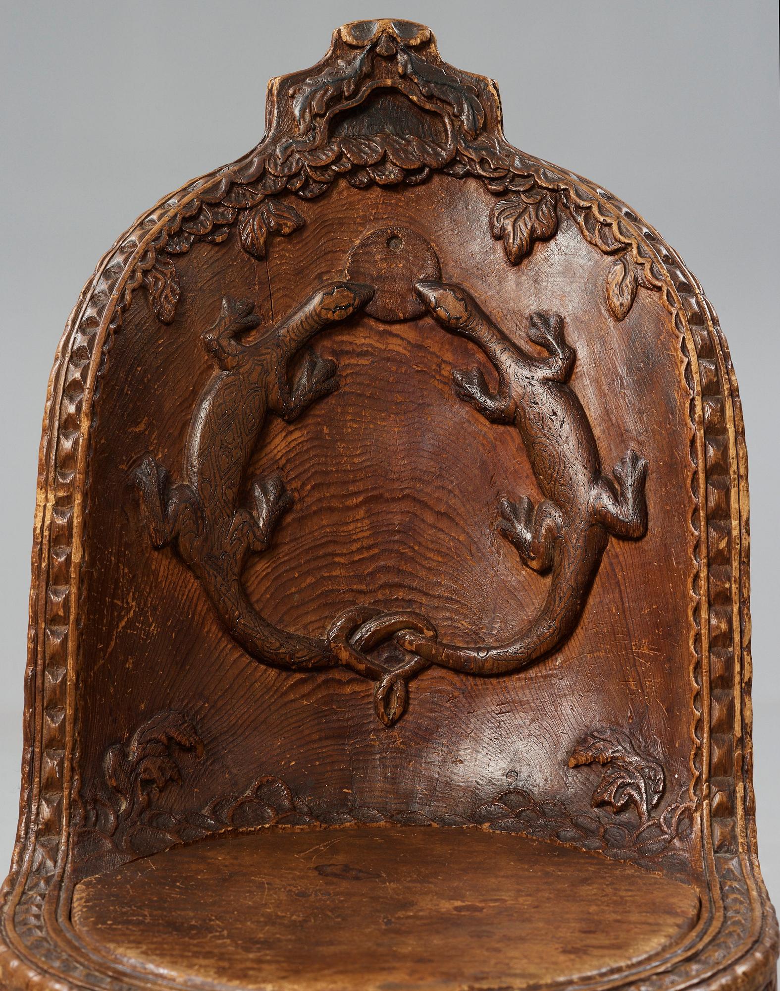 Knut Fjaestad, an Art Nouveau folk art sculptured pine chair, Sweden early 1900's.