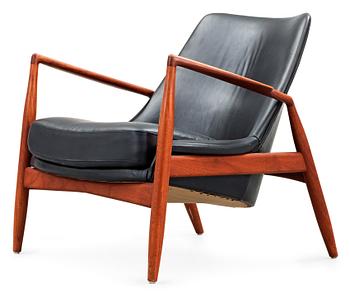 471. An Ib Kofod Larsen black leather and teak easy chair 'The Seal' by OPE, Sweden 1950-60's.