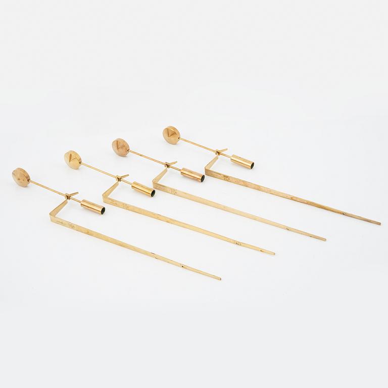 Pierre Forssell, a set of four brass 'Pendeln' wall lights from Skultuna, late 20th Century.