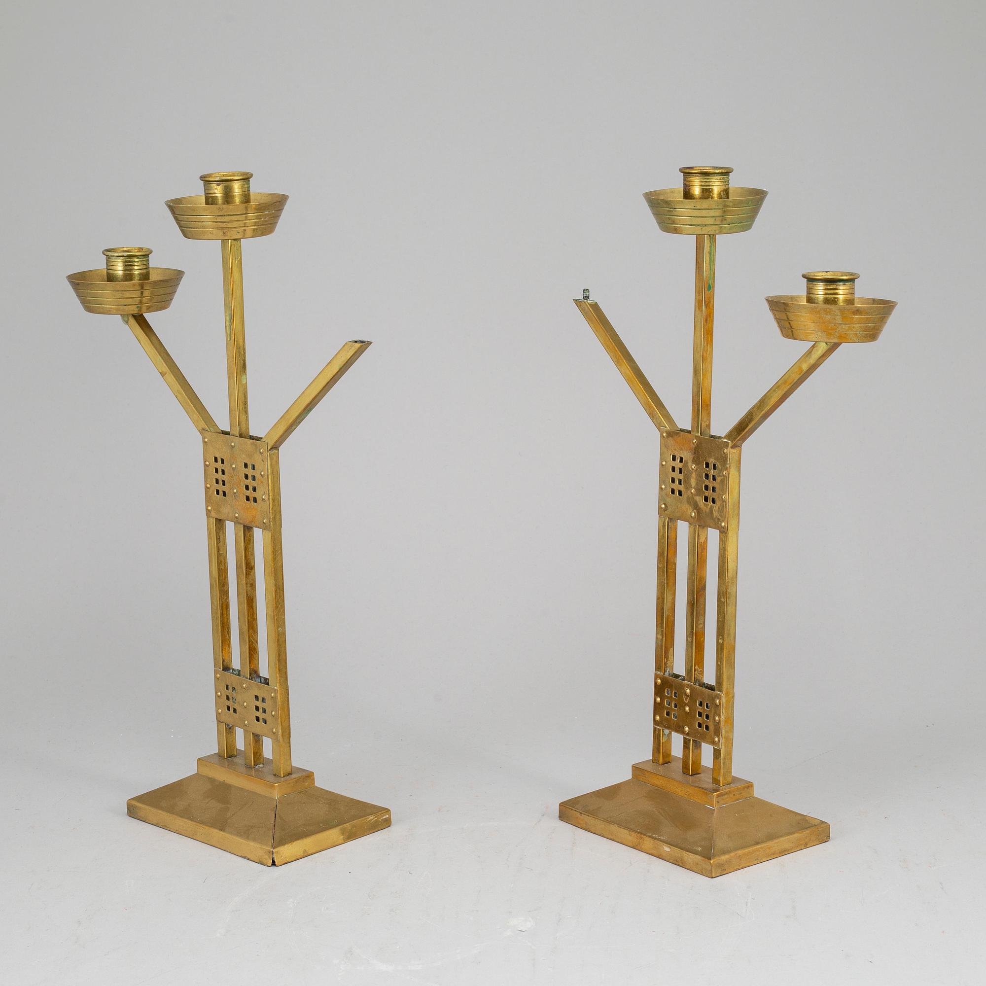 A pair of Art nouveau brass candelabra, early 20th Century.