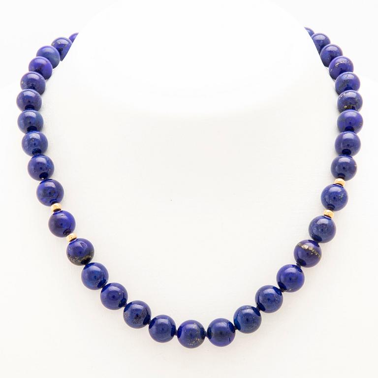 Necklace with an 18K gold clasp and Lapis Lazuli beads.