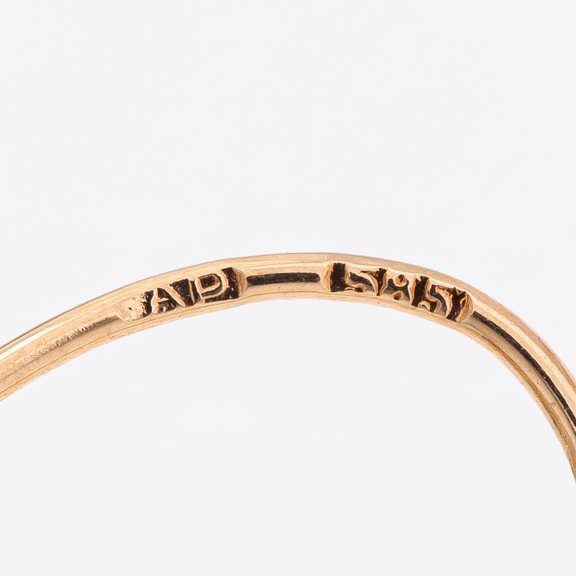 A pair of 14K gold earrings with synthetic spinels.