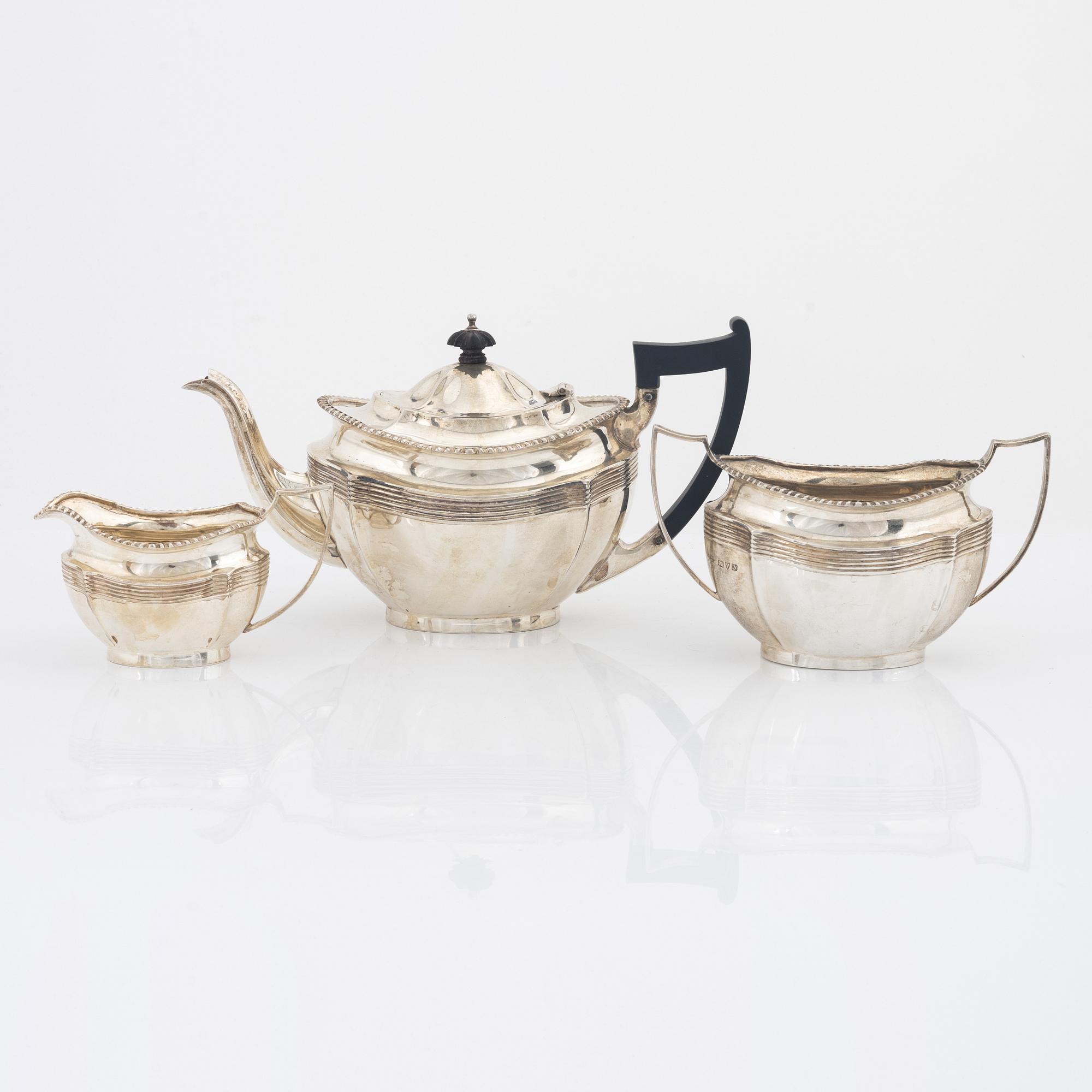 Barker Brothers (Herbert Edward Barker & Frank Ernest Barker), a silver teapot, creamer and sugar bowl, Chester 1924.
