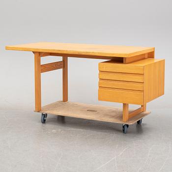 A pine writing desk by Olavi Hänninen for Nupponen, second half of the 20th Century.