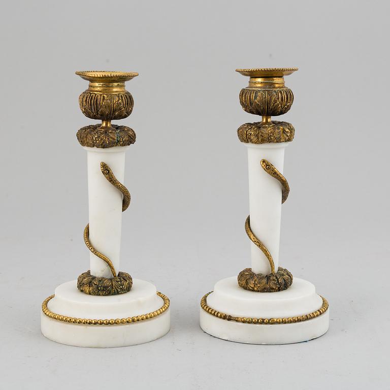 A pair of Louis XVI style candle sticks, circa 1900.