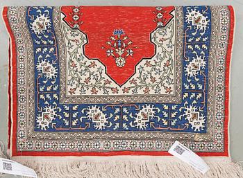 An oriental silk rug, around 73 x 53 cm.