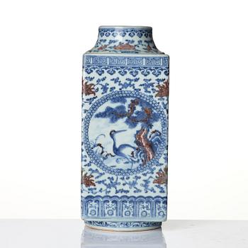 An underglaze blue and copper-red 'crane and deer' cong vase, Qing dynasty, 18/19th century.