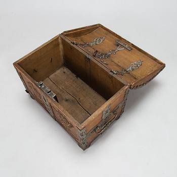 An oak wood chest dated 1710.