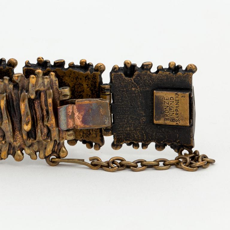 A bronze bracelet, ring and a pair of earrings by Pentti Sarpaneva, Finland.