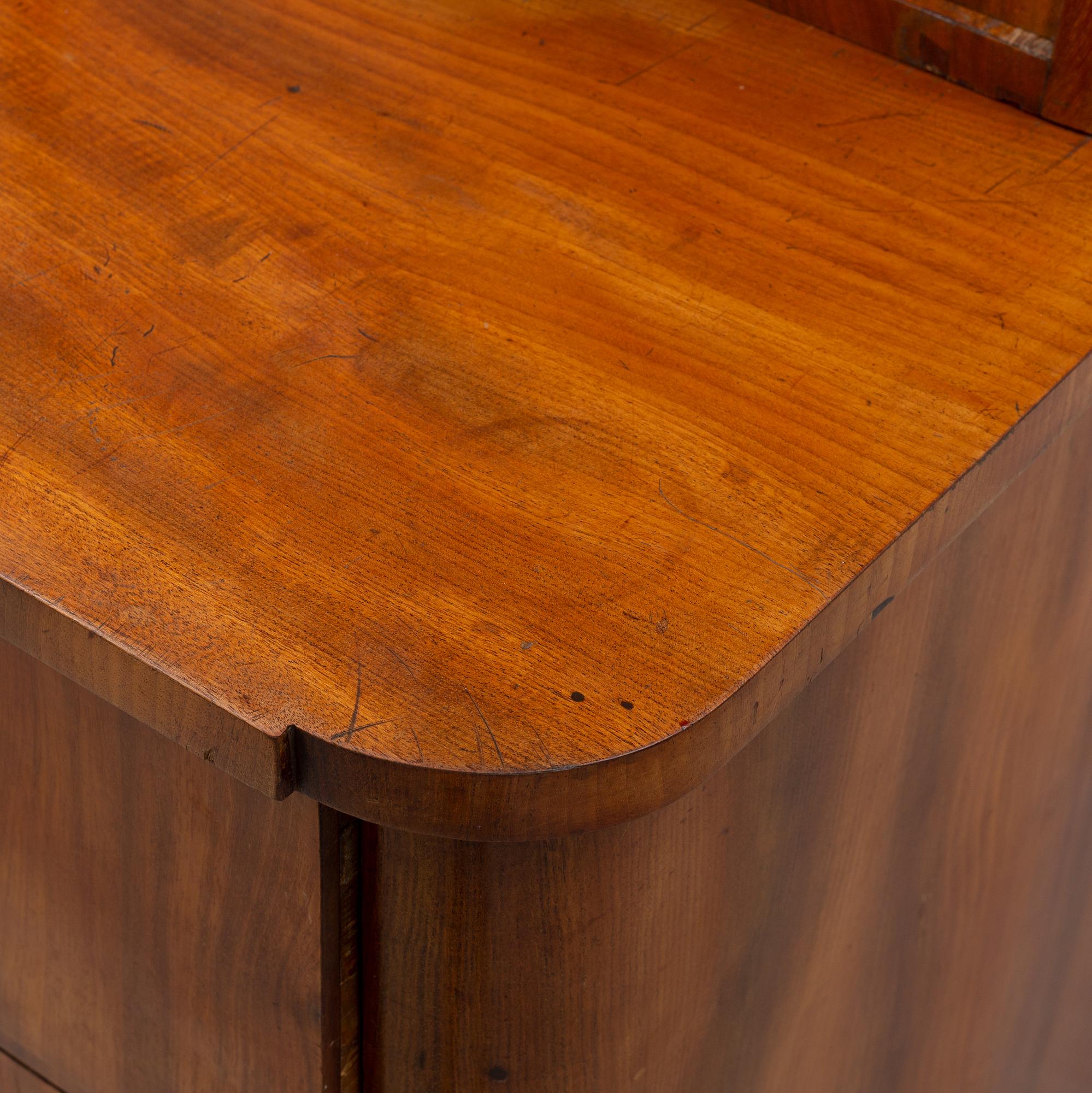 A mahogany veneered Empire cupboard, first half of the 19th century.