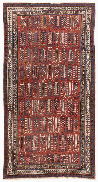 An antique carpet, probably Shirvan, c. 330 x 172 cm.