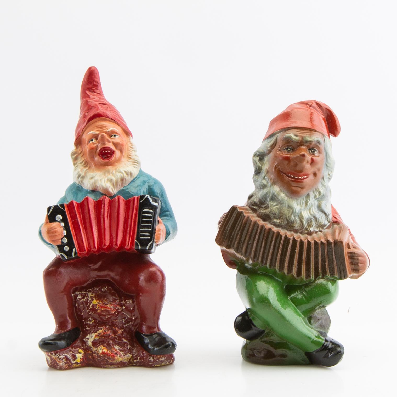 A collection of gnomes 12 pcs mid/late 20th century mostly painted terracotta.