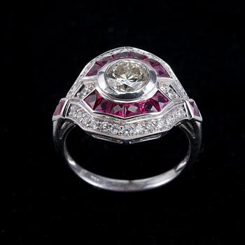 A RING, brilliant cut diamonds 1 x 1.00 ct + 0.37 ct. Fancy cut rubys.