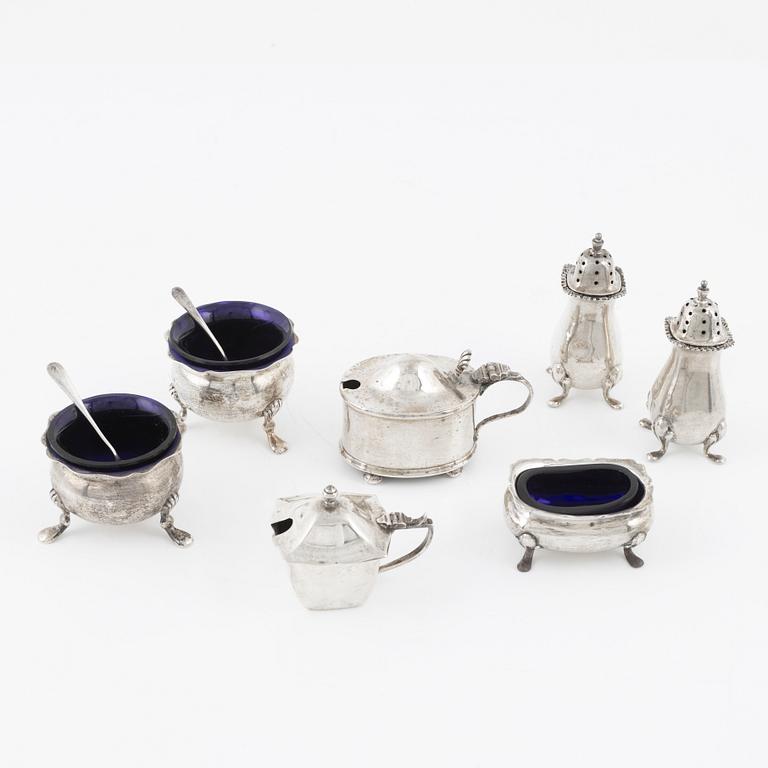 A seven piece silver spice set, with two sppons, England, mostly Birmingham.