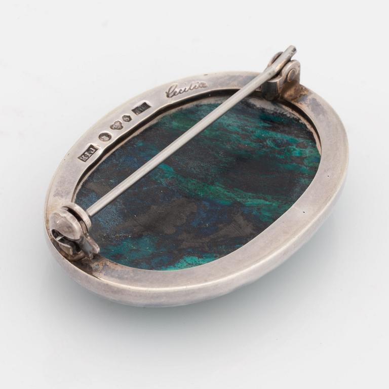 Cecilia Johansson, silver and cabochon cut green blue stone.