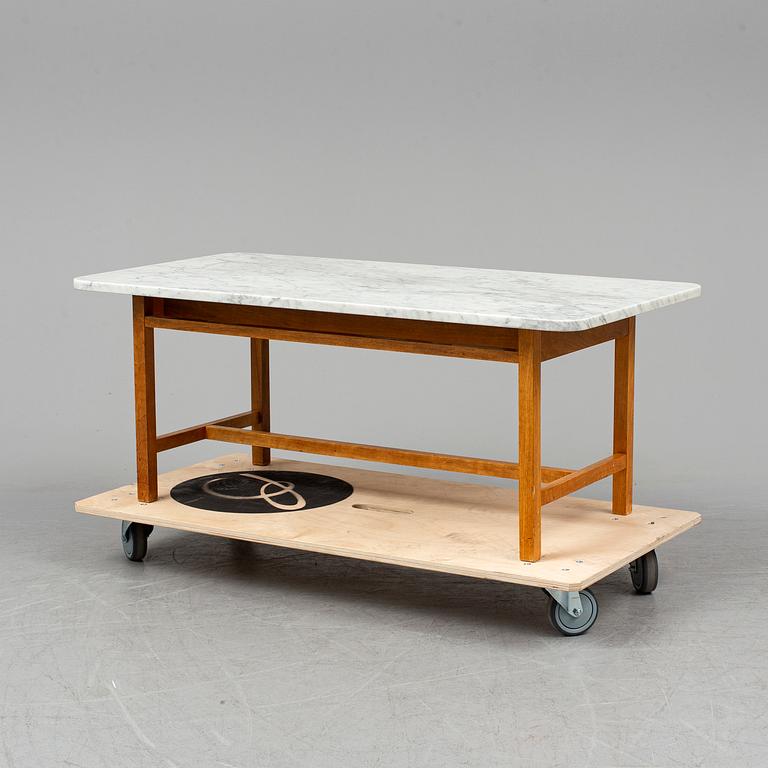 JOSEF FRANK, a model 2125 marble top coffee table from Svenskt Tenn.