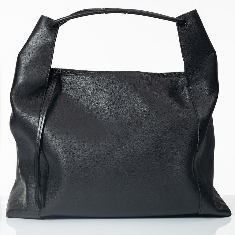 Gucci, A black leather hobo bag.