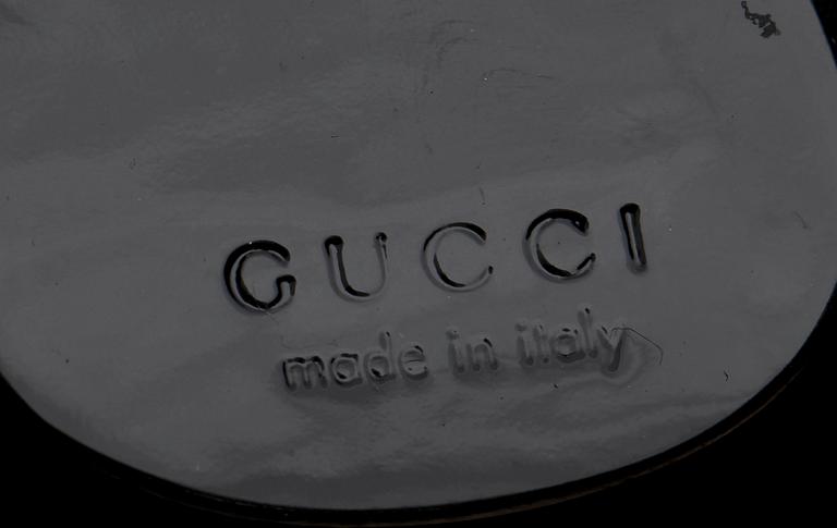 A black monogram suede handbag by Gucci, fall/winter 1997, The Tom Ford collection.