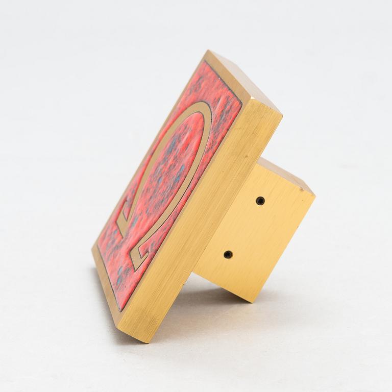 Omega, A door handle from the latter half of the 20th century.