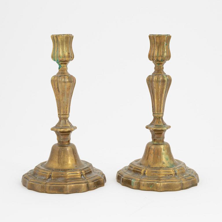 A pair of French brass candles sticks, 19th Century.