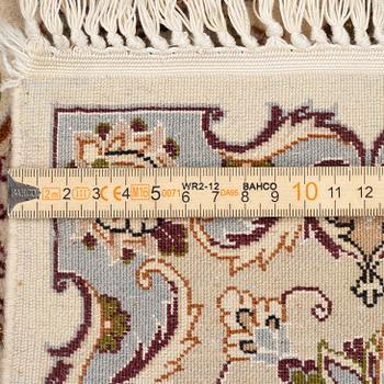 An Isfahan part silk rug, c. 161 x 110 cm.