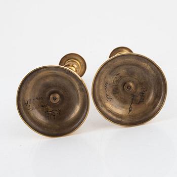 A pair of gilt brass Empire candlesticks, early 19th century.