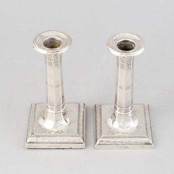 A pair of silver candlesticks, mark of Thomas Bradbury & Sons Ltd, Sheffield 1918.