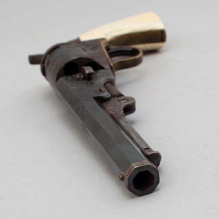 A Colt 1862 Pocket Navy percussion revolver with ivorygrip.