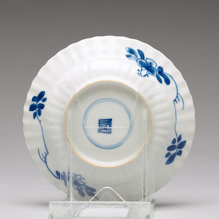 Seven matched blue and white cups with four dishes, Qing dynasty, Kangxi (1662-1722).