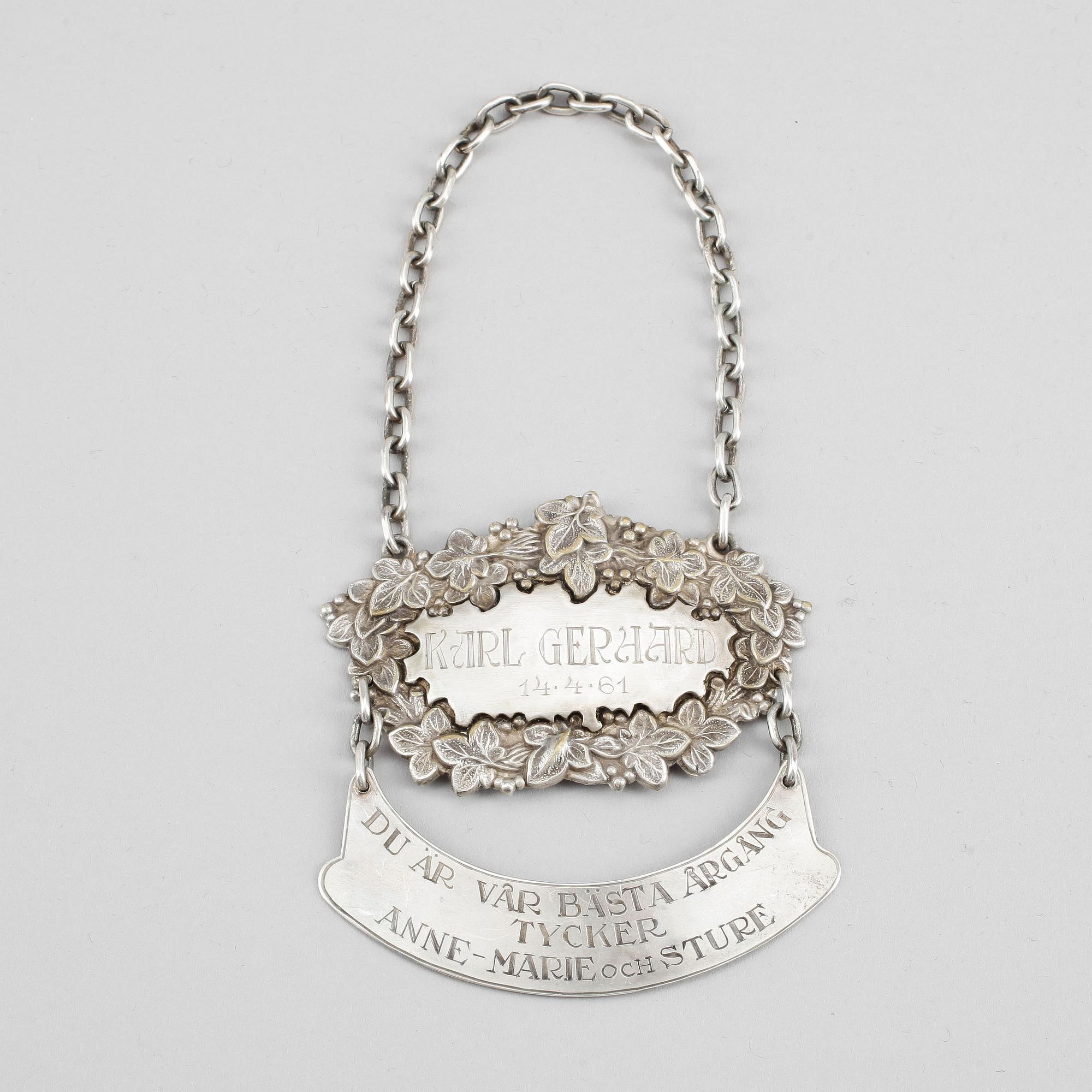 FLASKSKYLT, nysilver, 1900-tal.