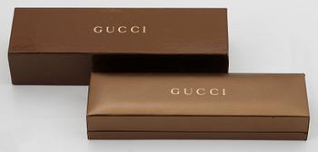 An 18K gold Gucci bracelet.