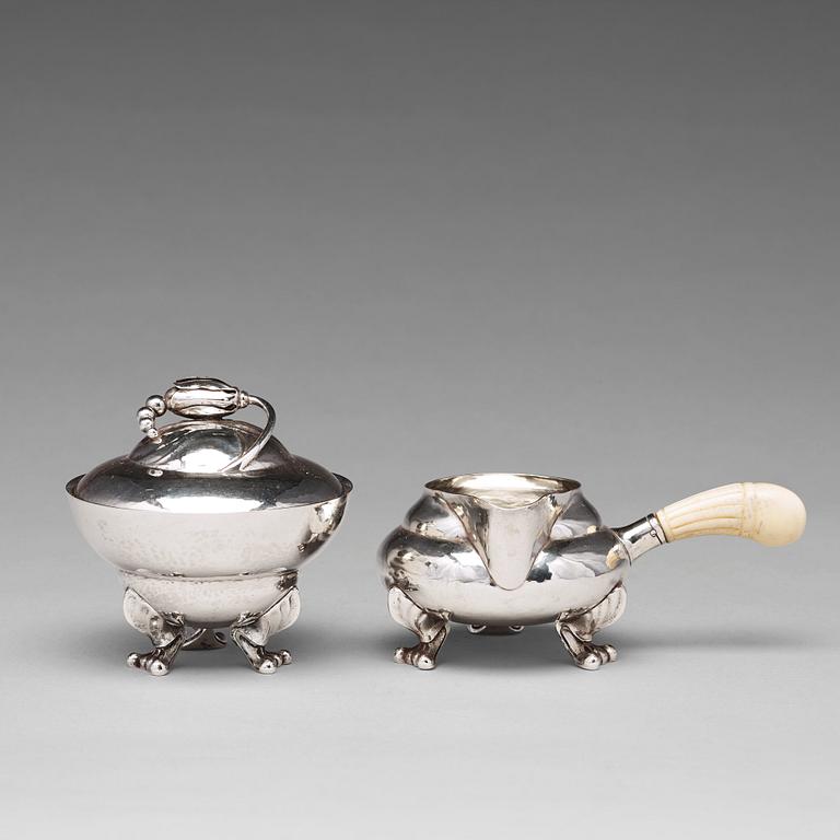 Georg Jensen, a "Blossom" sugarbowl and creamer, Copenhagen 1919-21, 830/1000 silver.