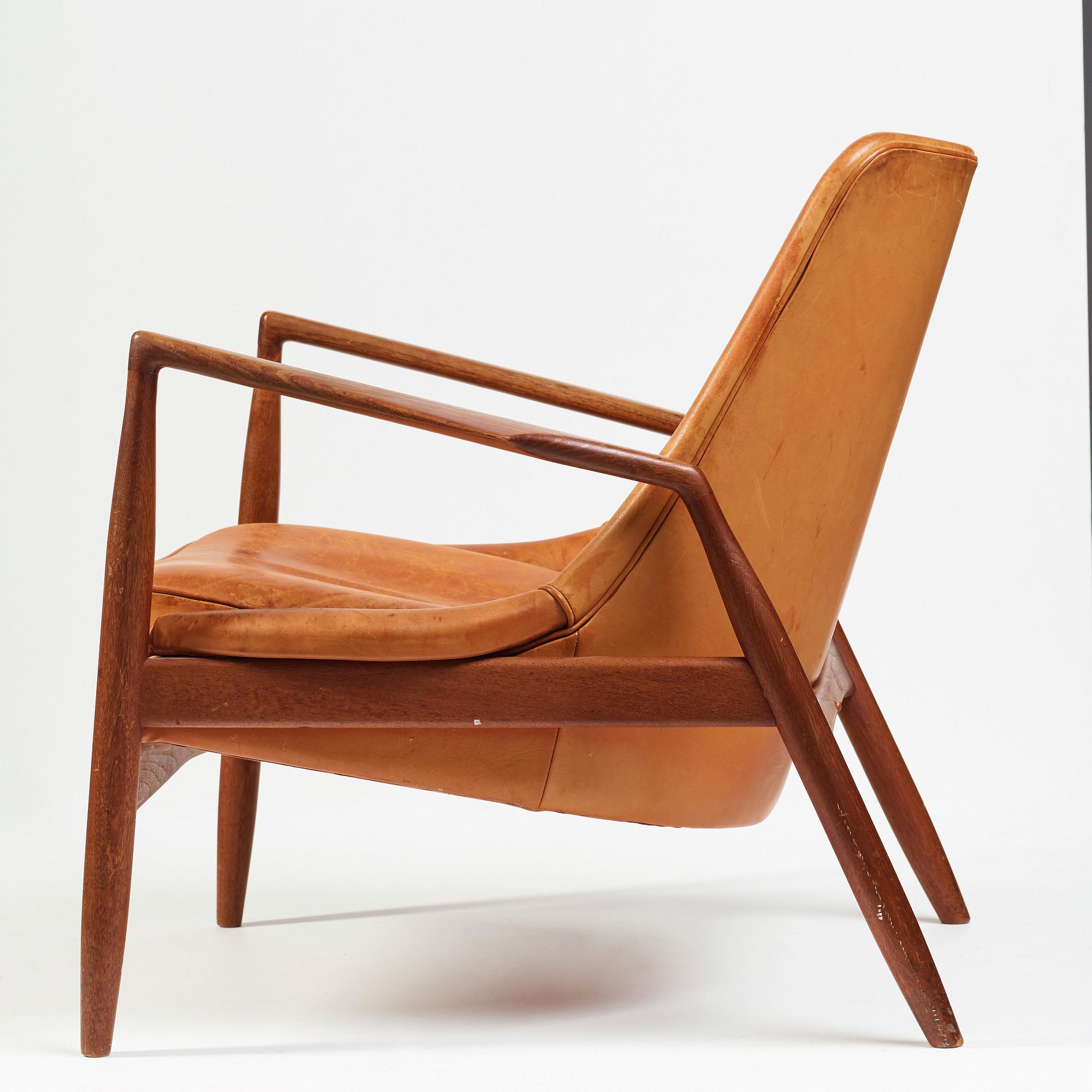 Ib Kofod-Larsen, a "Seal" teak and brown leather armchair, Olof Persson Möbler, Jönköping, Sweden 1950-60's.