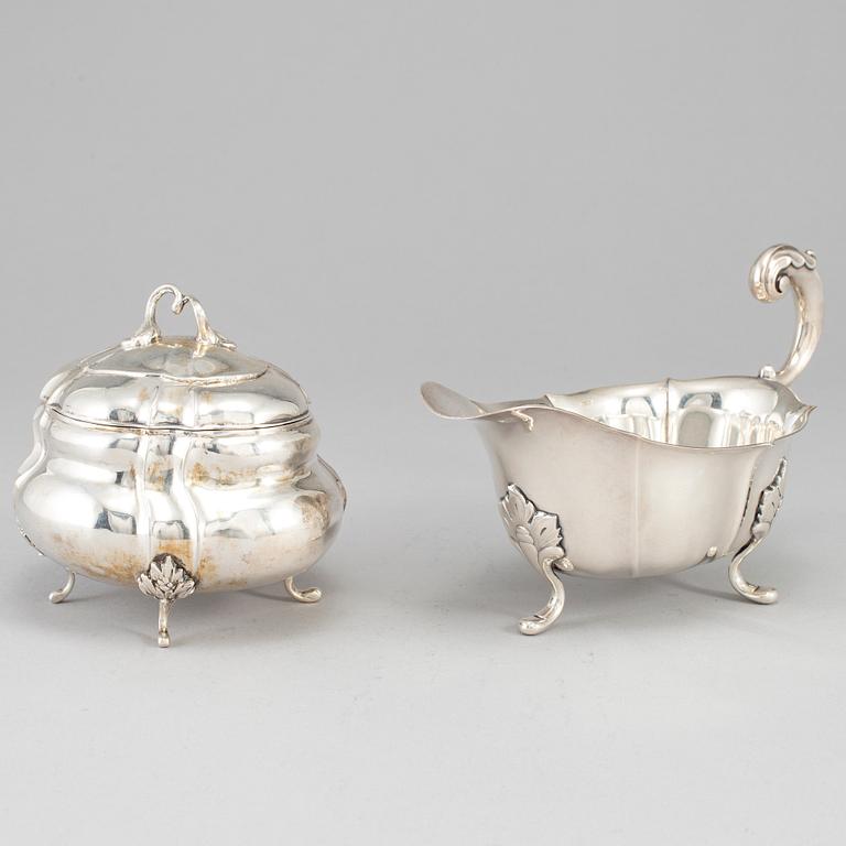 A rococo-style 20th century silver cream-jug and sugar-box, Swedish import marks.