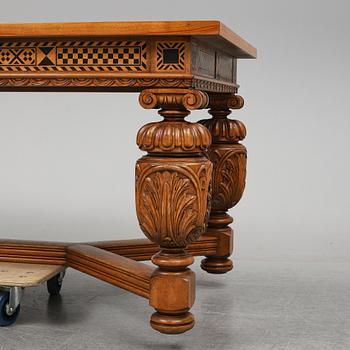 A 20th century baroque-style mahogany table.