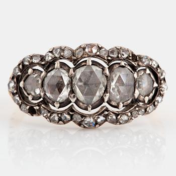 1155. An 18K gold and silver ring set with rose-cut diamonds.