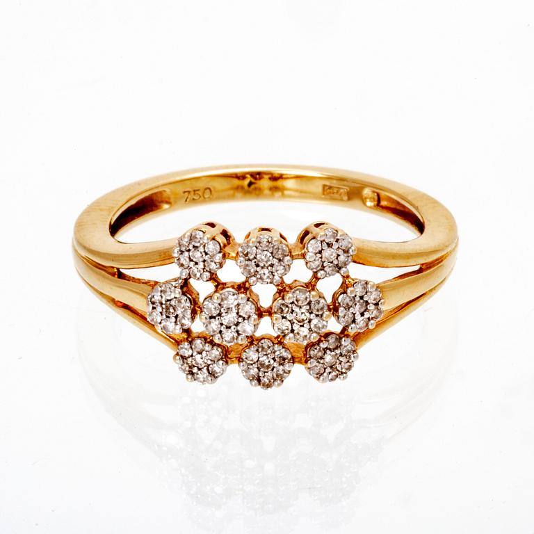 An 18K gold ring with octagonal cut diamonds.