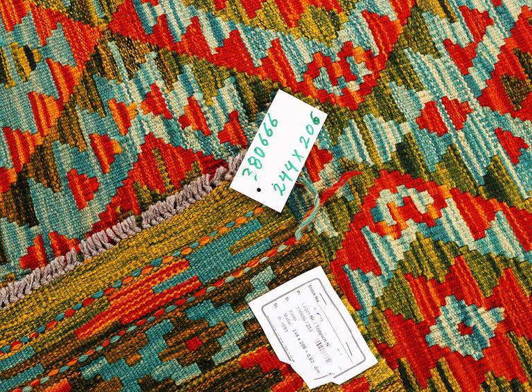 An Afghan Kelim carpet, c. 244 x 206 cm.
