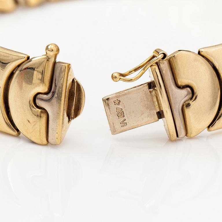 A 14K white and yellow gold bracelet.