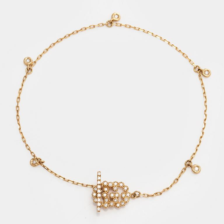 Gucci, armband, "Interlocking", 18K guld med briljantslipade diamanter.