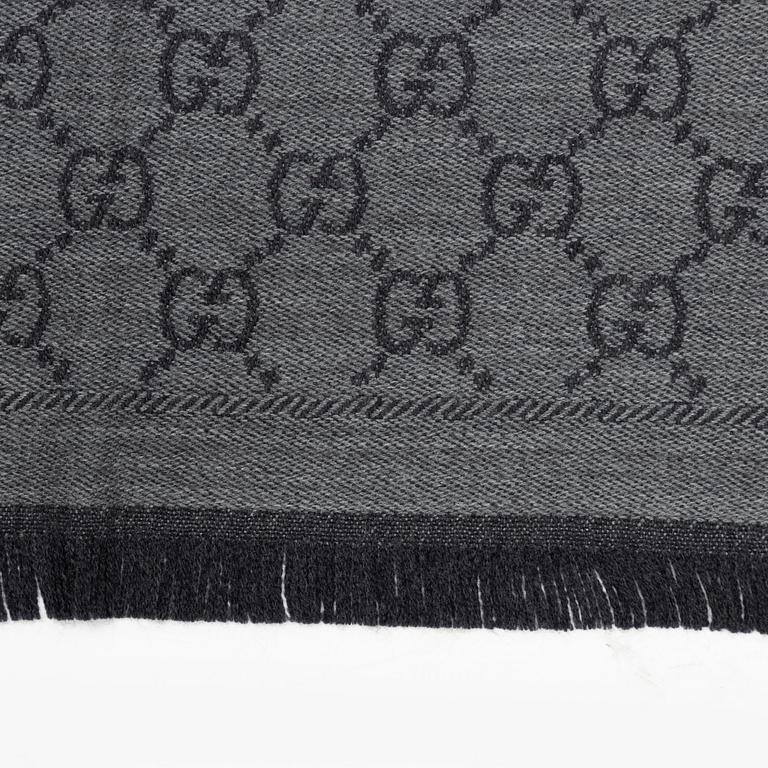 Gucci, a wool 'GG Jaquard Knitted Scarf'.