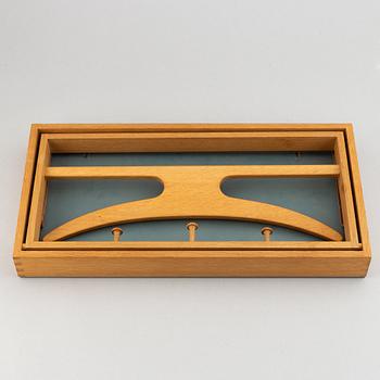 A clothes hanger by Adam Hoff & Poul Östergaard, Virum Möbelsnickeri, Denmark, mid 20th.