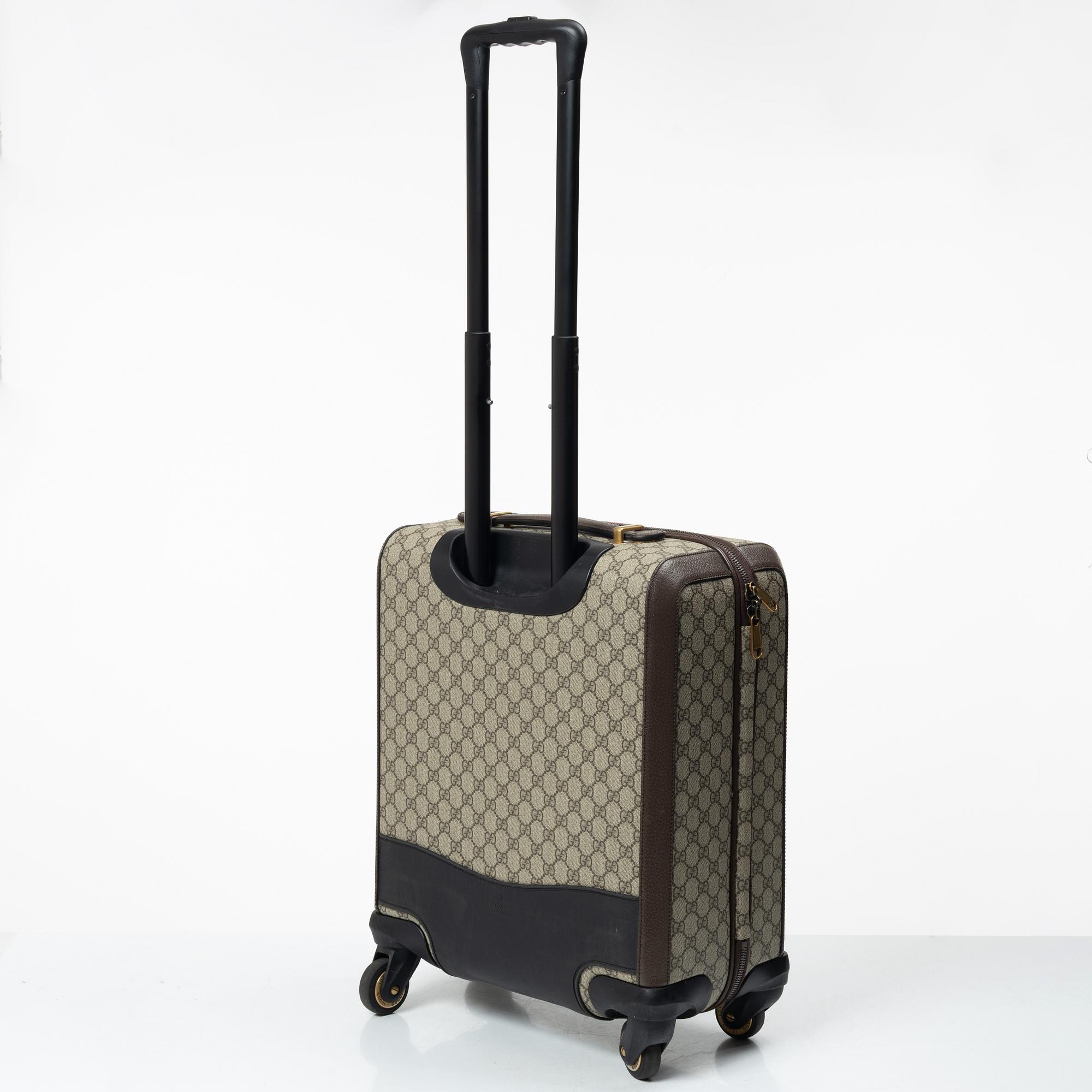 Gucci, suitcase / cabin bag.