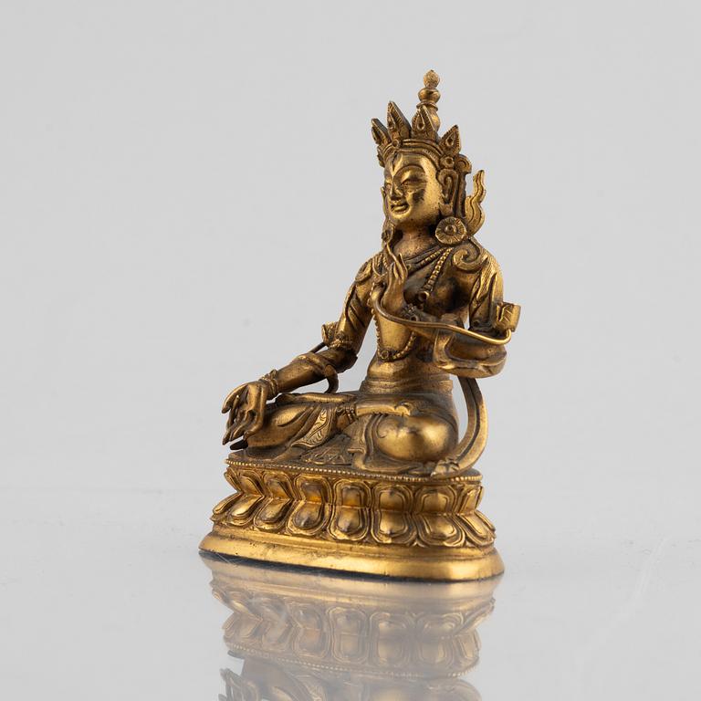 A gilt copper figure of a Buddha, 20th century.