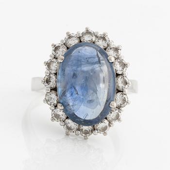 Ring with cabochon-cut sapphire and brilliant-cut diamonds.