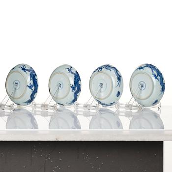 A set of four blue and white dragon dishes, Qing dynasty, 18th Century.